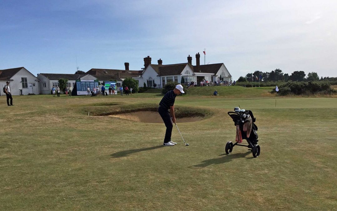 Golfer chipping at Aldeburgh